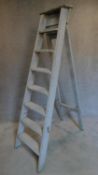 A vintage distressed painted set of step ladders. H.194cm