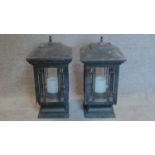 A pair of grey storm lanterns. 60x32cm