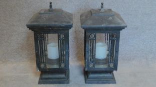 A pair of grey storm lanterns. 60x32cm