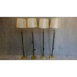 A set of four corinthian column style standard lamps. H.171cm
