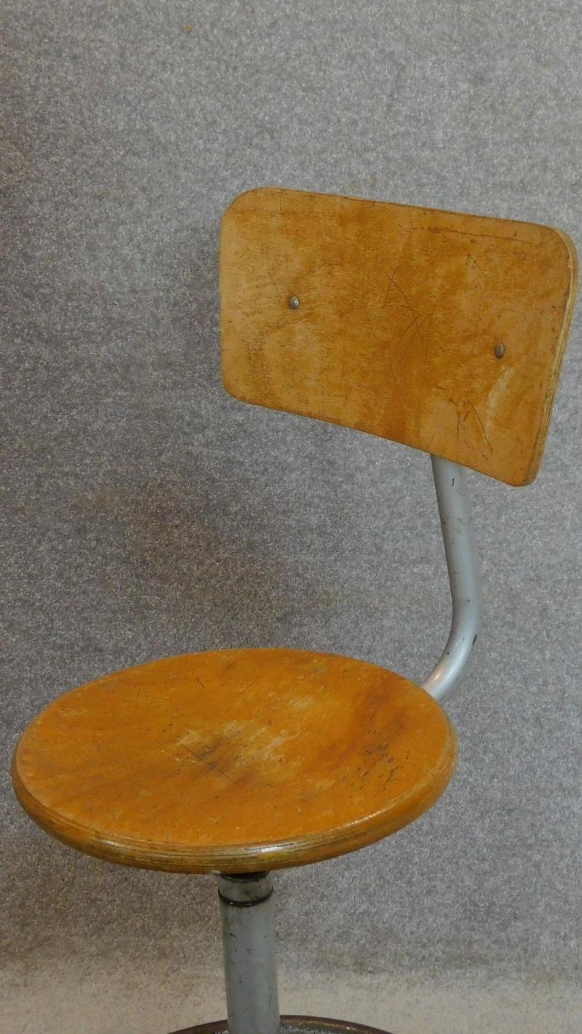 A vintage revolving adjustable industrial machinist's stool with laminated beech seat and back. - Image 2 of 5