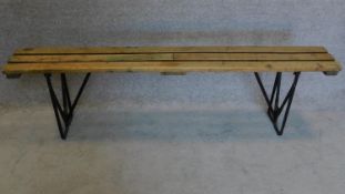 A fold down trestle end planked top bench. 52x180cm