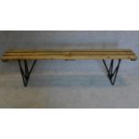 A fold down trestle end planked top bench. 52x180cm