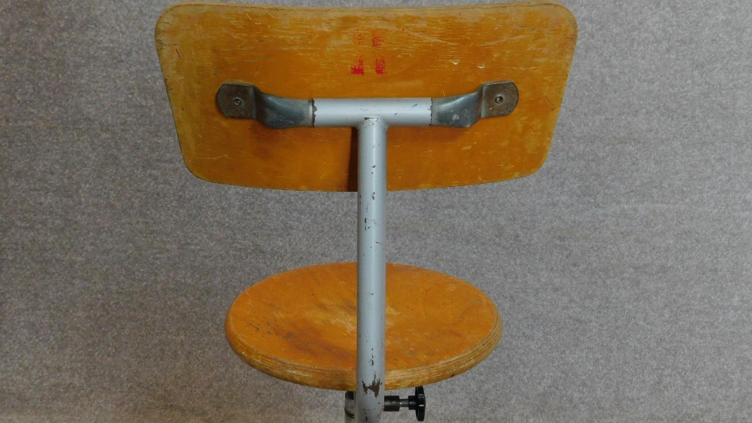 A vintage revolving adjustable industrial machinist's stool with laminated beech seat and back. - Image 3 of 5