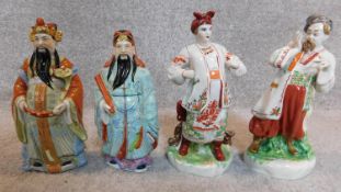 A pair of chinese figures and a pair of Russian similar. H.25cm