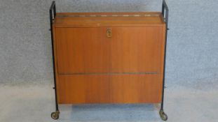 A 1960's vintage teak fitted drinks trolley on casters. 66x62cm