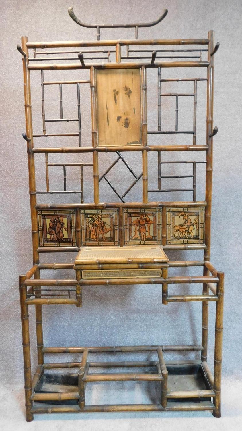 A late Victorian aesthetic style bamboo hallstand with inset tiles. 198x96x30cm (mirror detached but