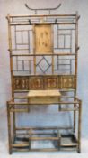 A late Victorian aesthetic style bamboo hallstand with inset tiles. 198x96x30cm (mirror detached but