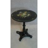 A Victorian ebonised painted and mother of pearl inlaid circular occasional table. 70x61x61cm