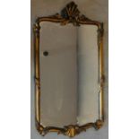 A Georgian style carved scroll and acanthus giltwood pier mirror. 94x51cm