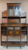 A late 19th century rosewood and satinwood inlaid mirror backed sideboard, urn and swag arabesque