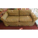 A two seat sofa with Arts and Crafts style tapestry loose covers and feather filled cushions.