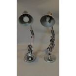 A pair of chrome adjustable angle poise lamps. H.65cm