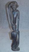 An African teak carving, two standing figures. 73x14cm