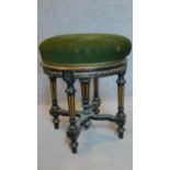 A Victorian ebonised and gilt adjustable piano stool. H.48cm