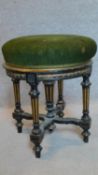 A Victorian ebonised and gilt adjustable piano stool. H.48cm