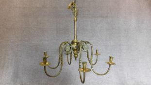 A brass Dutch style six branch chandelier with candle sconces 85x85cm (unwired)