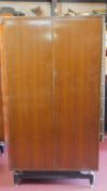 A vintage teak E. Gomme G-Plan fitted gentleman's wardrobe. 171x92x54cm