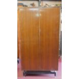 A vintage teak E. Gomme G-Plan fitted gentleman's wardrobe. 171x92x54cm