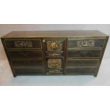 A lacquered and carved Chinese sideboard fitted central cupboard flanked by drawers. 90x180x45cm