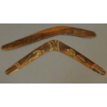 Two boomerangs, one carved. W.55cm