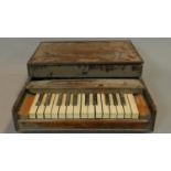 A cased miniature keyboard. 55x47cm (not working A.F.)