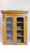 A late Victorian mahogany bookcase section with twin glazed doors. 122x98cm (One pane detached but