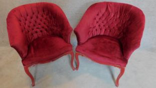 A pair of buttoned tub shaped bedroom chairs. H.85cm