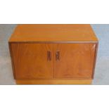 A teak two door G-Plan cabinet. 53x81x46