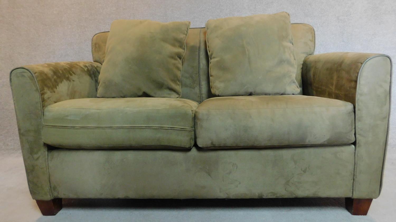 A 2 seater sofa in sage faux suede upholstery. 88x145x93cm - Image 2 of 5