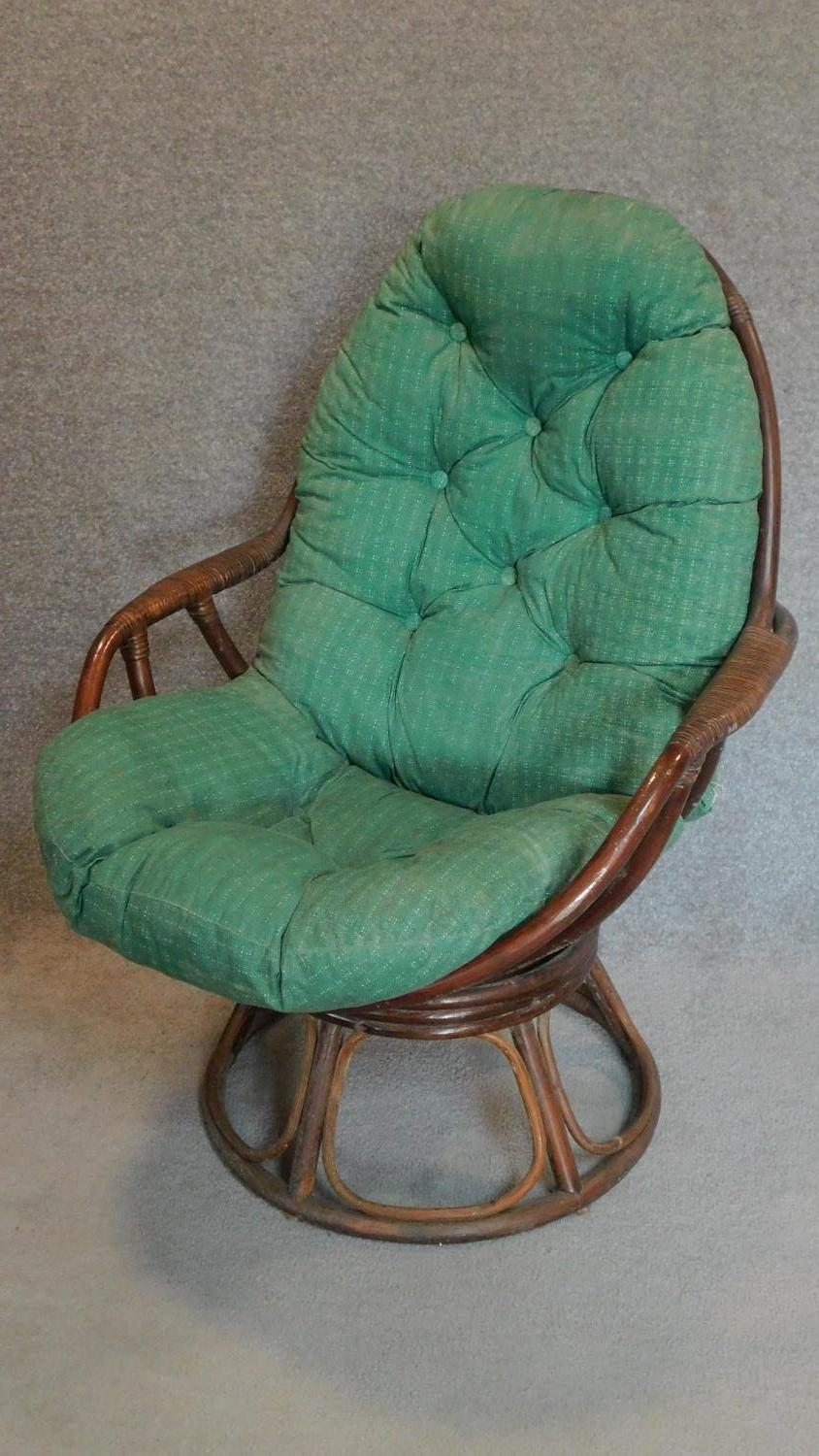 A vintage cane conservatory tub chair. H.102cm