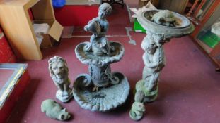 A miscellaneous collection of stone garden figures, fountain, cupid, lion etc. H.95 (tallest)