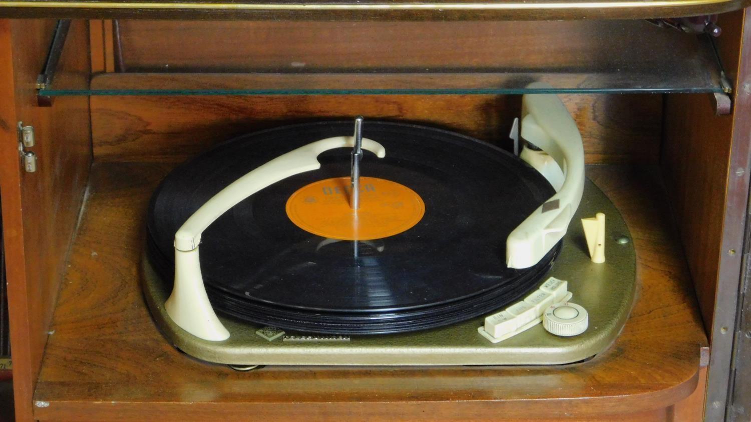 A 1960's vintage German radio and record player. 83x96x41cm (one leg loose) - Image 3 of 12