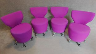 A set of four orangebox low chairs on casters. H.81cm