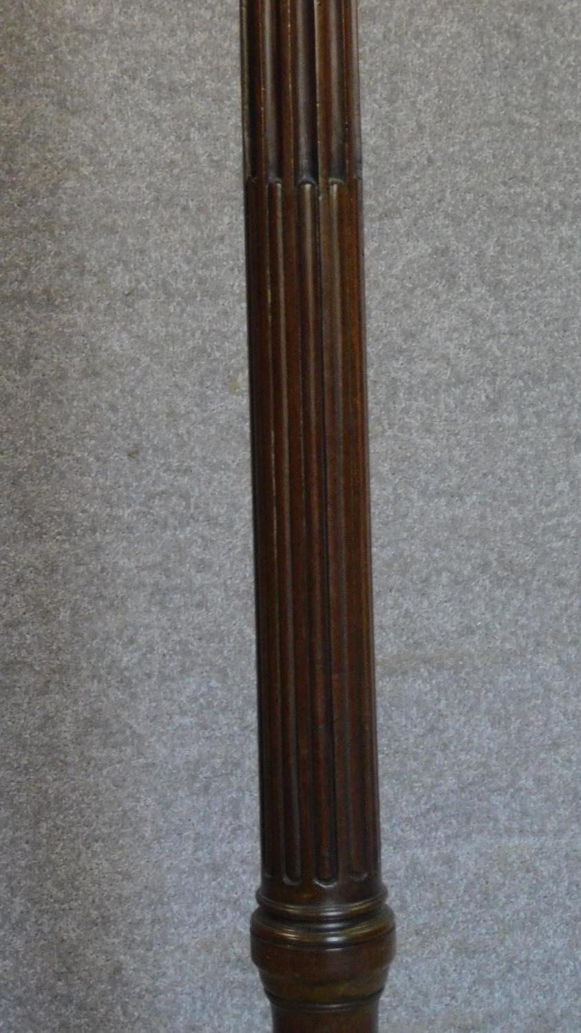 A mahogany coatstand with triple brass hooks on reeded column on quadruped carved cabriole - Image 4 of 5