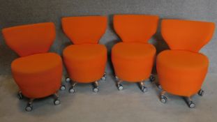 A set of four orangebox low chairs on casters. H.81cm