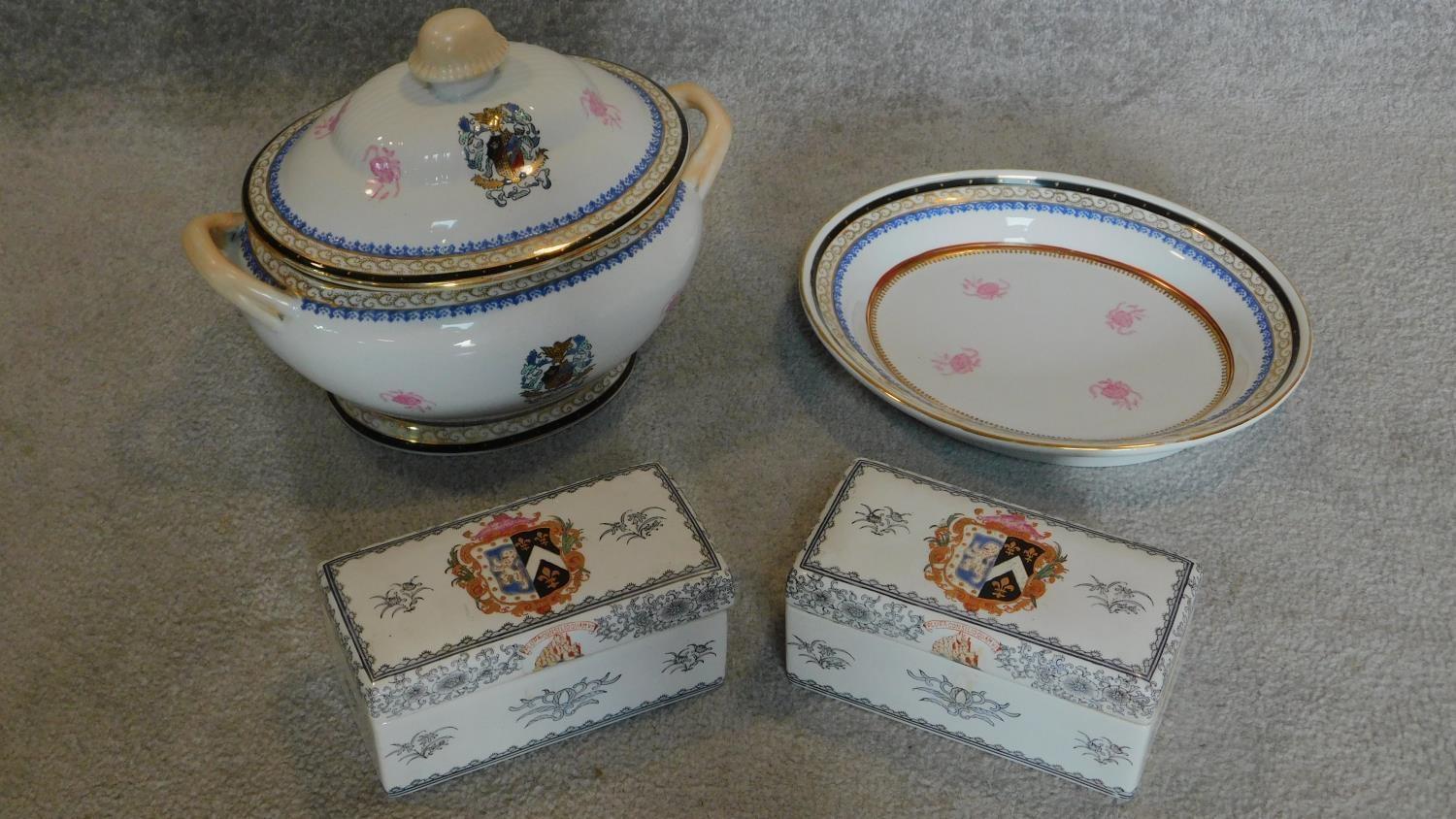 A gilt and crested tureen, a similar dish and a pair of lidded boxes.