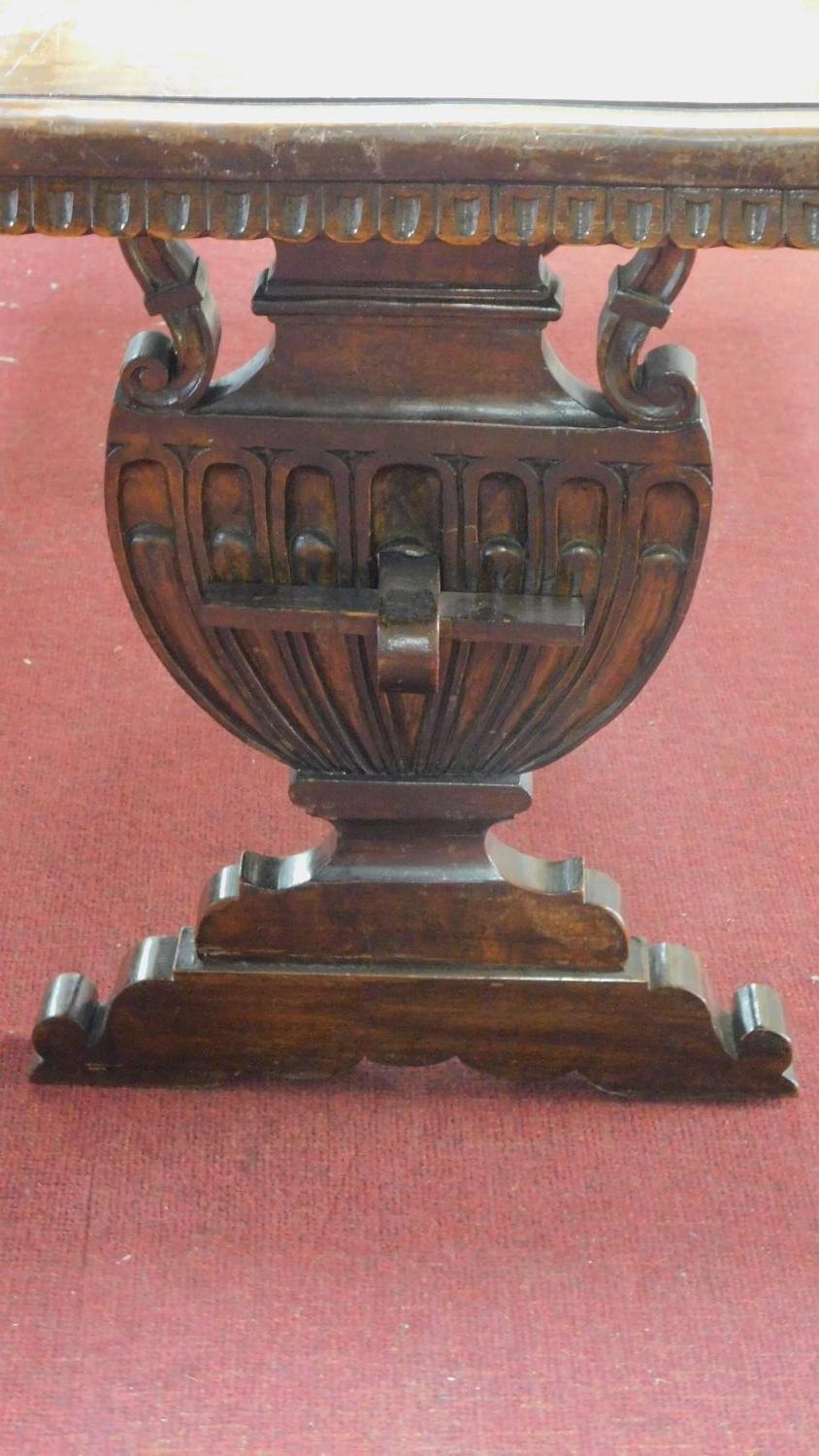 A continental oak refectory table with urn carved stretchered trestle ends. 76x150x72cm - Image 4 of 7