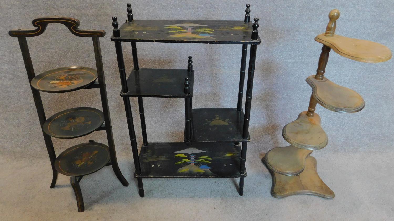 A Japan lacquered shelved whatnot a similar cakestand and a plant pot stand. H.76cm (tallest)