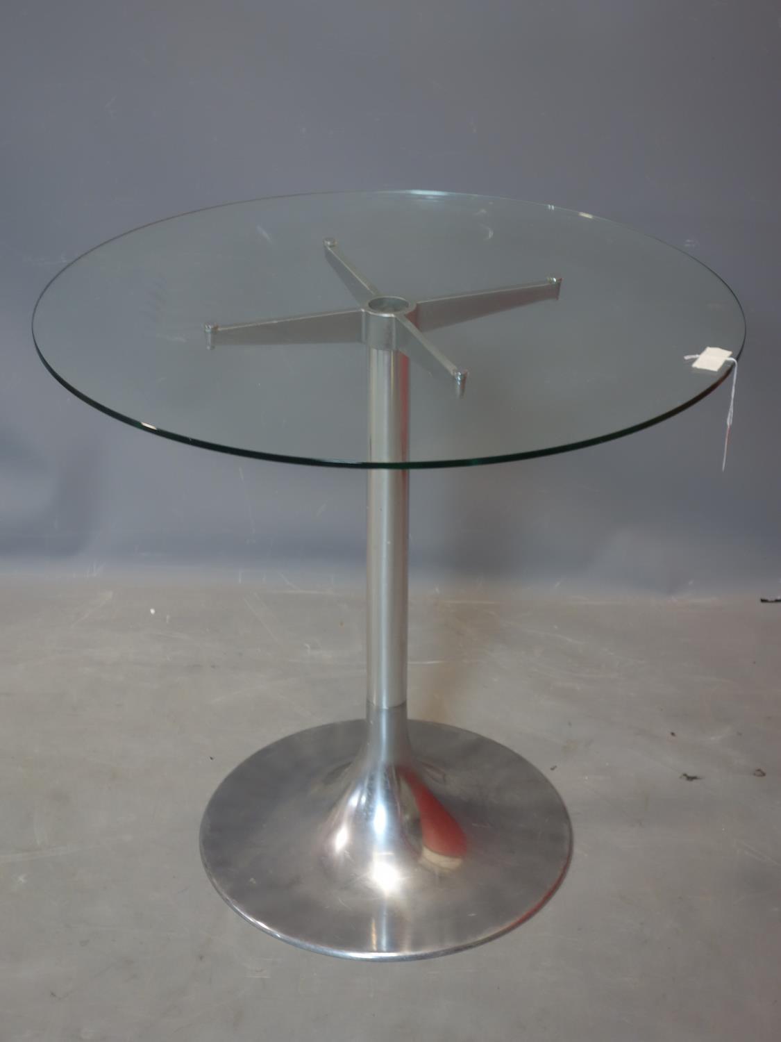 A vintage Circular glass topped table, raised on chrome base, H.73 D.76cm