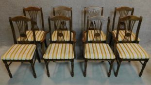 A set of eight pierced splat back dining chairs. H.92cm