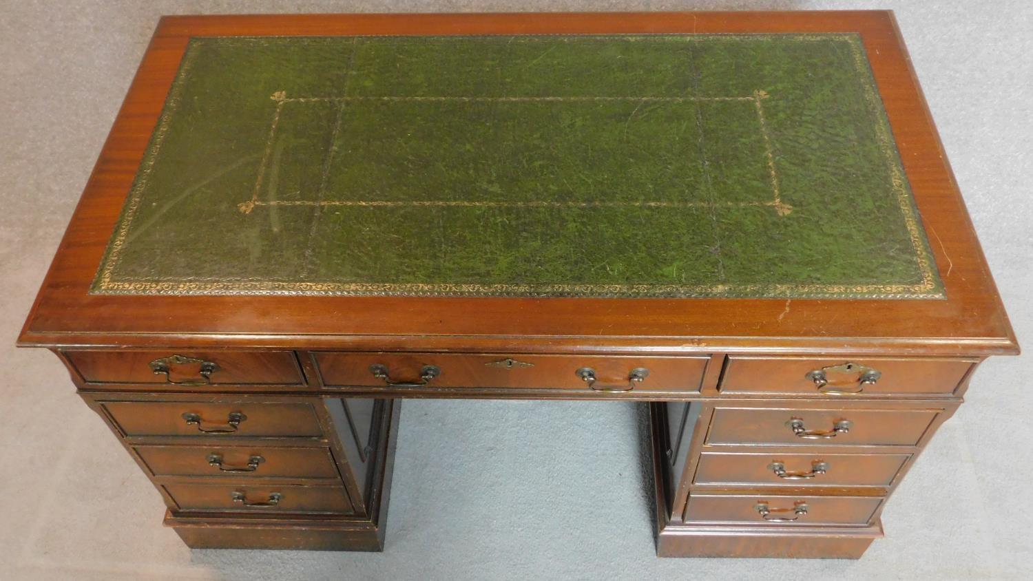 A Georgian style mahogany three section pedestal desk with tooled green leather inset top. - Image 4 of 6