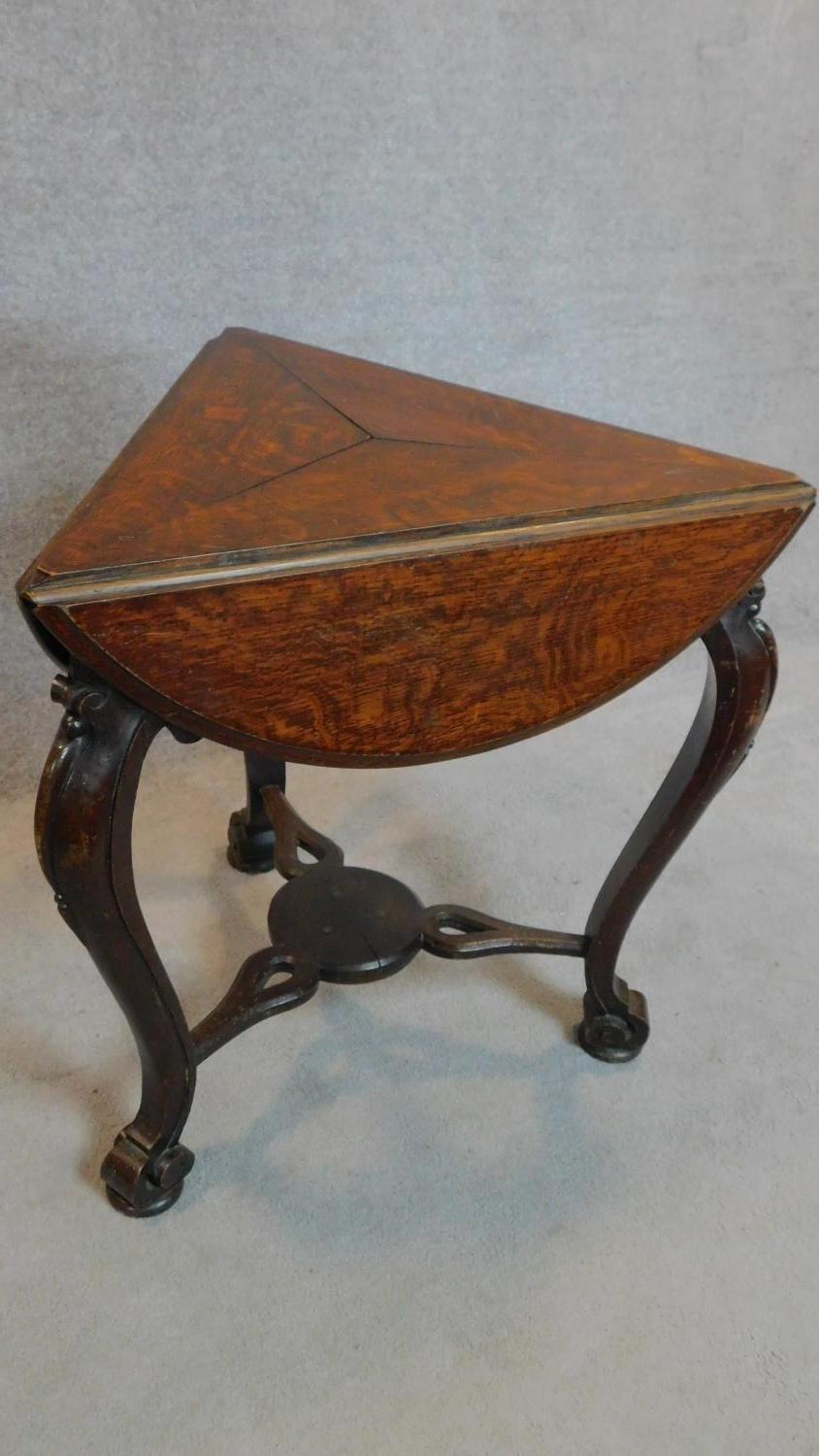 A 19th century Continental carved oak swivel action trefoil flap centre table. 74x82x82cm - Image 3 of 7