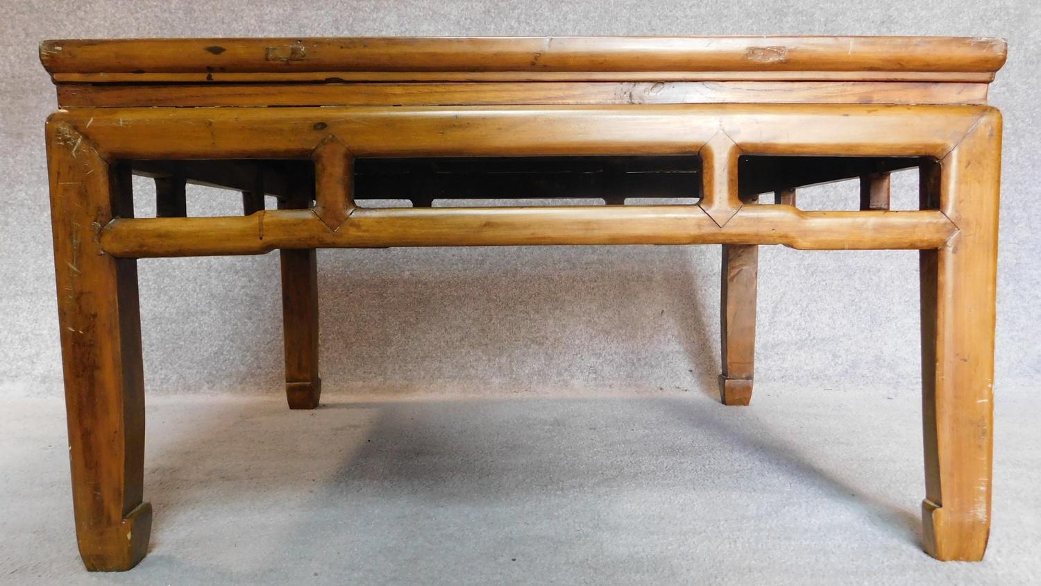 A Chinese style teak low table with inset rattan top. 50x88x88cm - Image 2 of 5