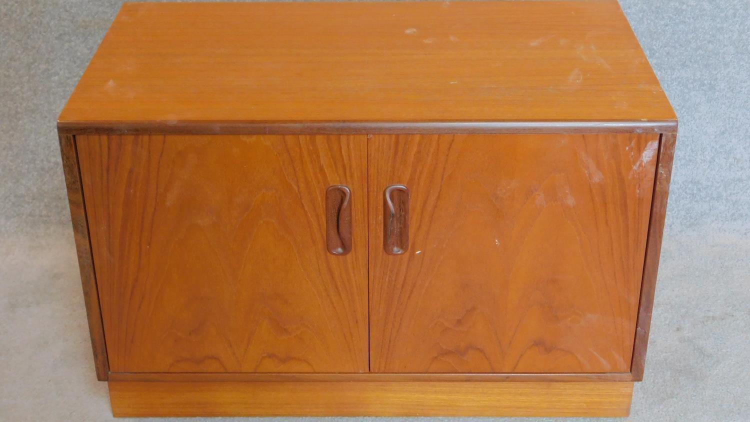 A teak two door G-Plan cabinet. 53x81x46