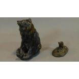 A figure of a seated bear and a small bronze figure of the cat sitting on the mat. H.25 (tallest)