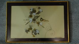 A glazed and framed abstract collage of expanding watch parts. 61x91cm