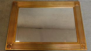 A reeded gilt framed rectangular mirror with bevelled plate. 94x69cm
