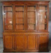 A mid 19th century mahogany library bookcase the upper glazed section with four doors above base