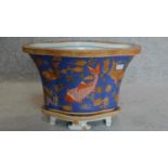 A small painted Chinese planter with goldfish decoration, character marks to base. H.27cm